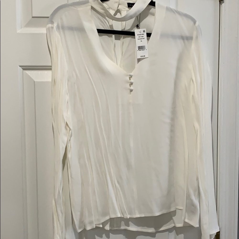 White blouse with tags